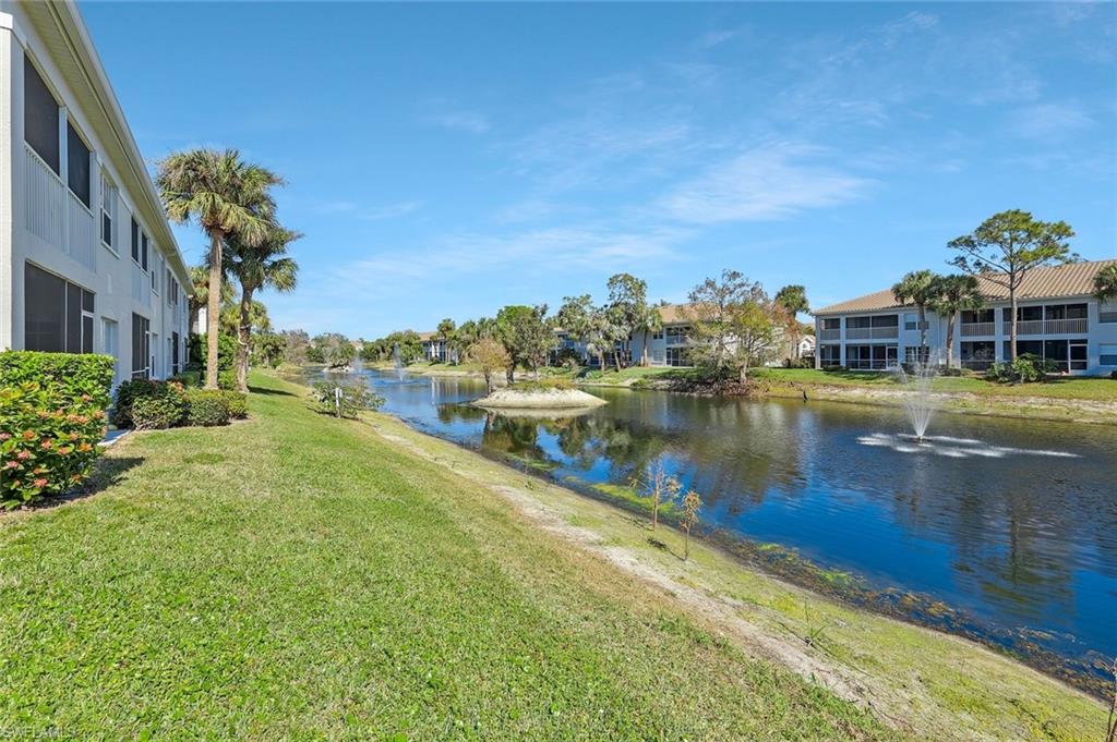 6812 Satinleaf Road South, Unit 204 Naples, FL 34109 - Photo 31 of 39 a view of a lake with houses