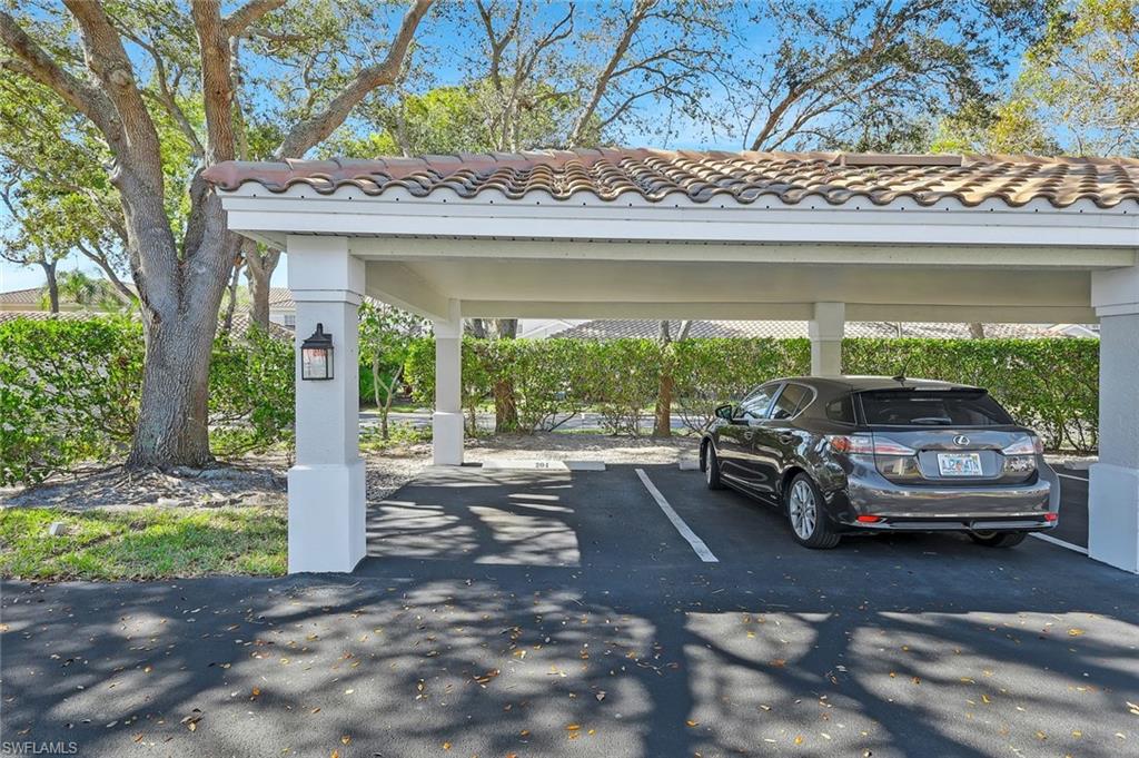 6812 Satinleaf Road South, Unit 204 Naples, FL 34109 - Photo 34 of 39 a car parked in front of a house