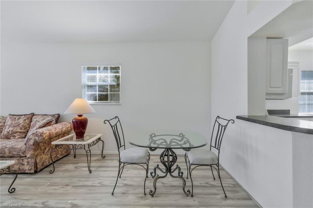 6812 Satinleaf Road South, Unit 204 Naples, FL 34109 - Photo 10 of 39 a workspace with furniture and window