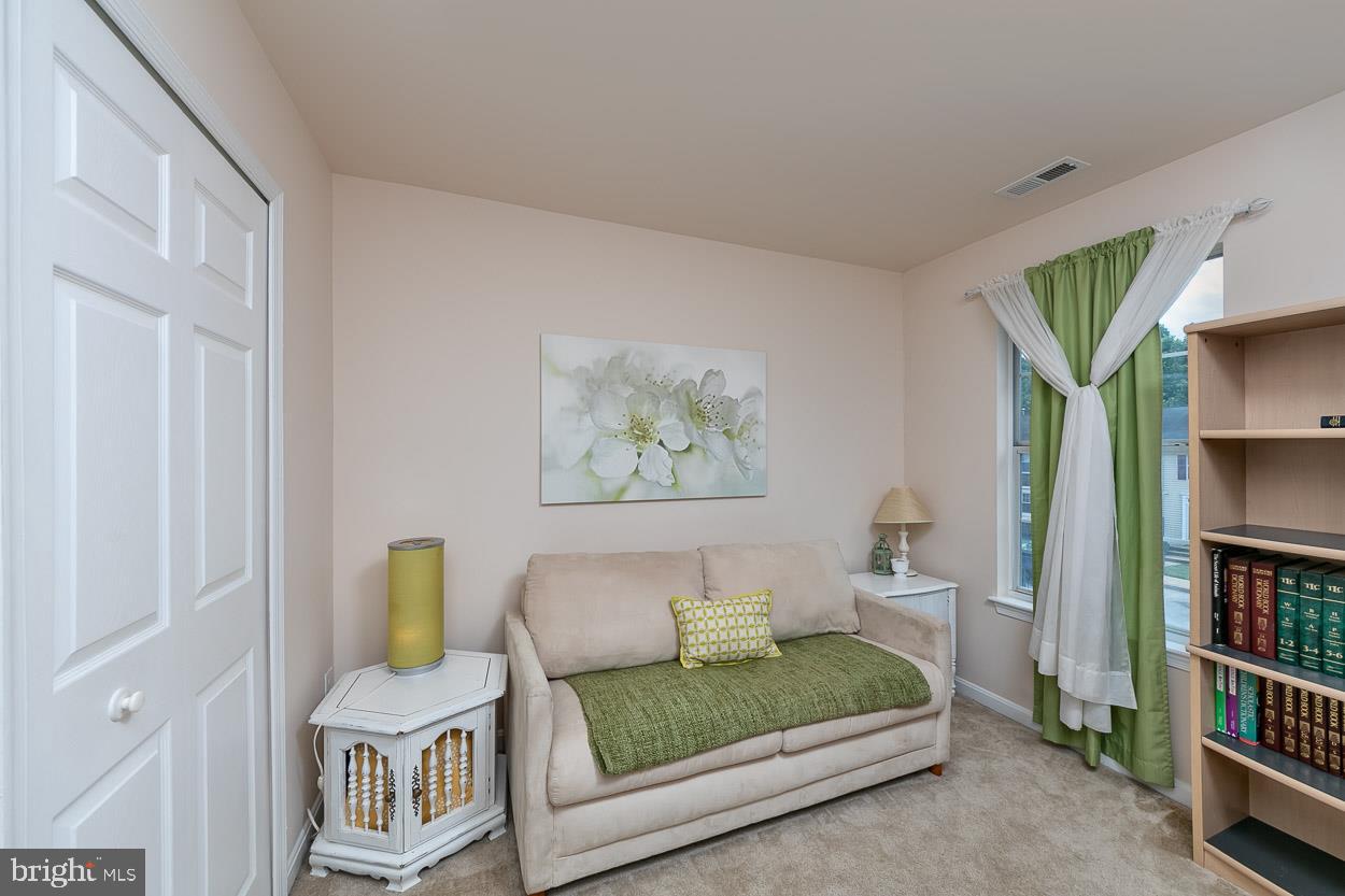 3504 Corn Stream Road Randallstown, MD 21133 - Photo 23 of 34 a bedroom with furniture and a book shelf