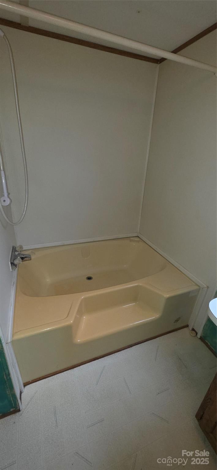 2111 Boxcar Road Lancaster, SC 29720 - Photo 14 of 21 a bathroom with a shower and a bath tub