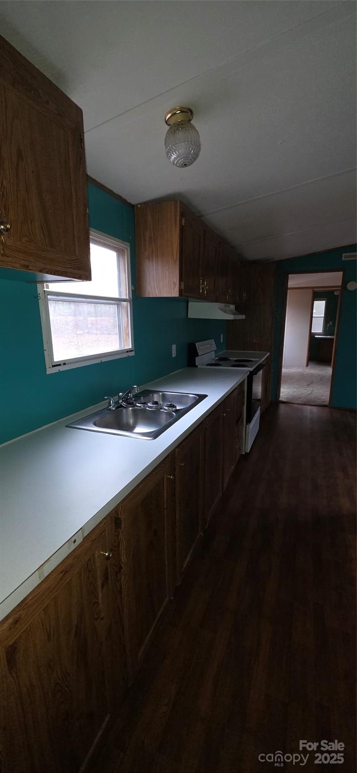 2111 Boxcar Road Lancaster, SC 29720 - Photo 16 of 21 a kitchen with stainless steel appliances a sink dishwasher a stove and black cabinets