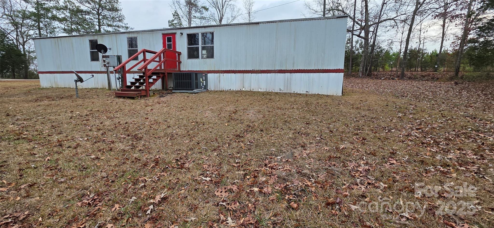 2111 Boxcar Road Lancaster, SC 29720 - Photo 21 of 21 a view of a garage with a table and a chairs