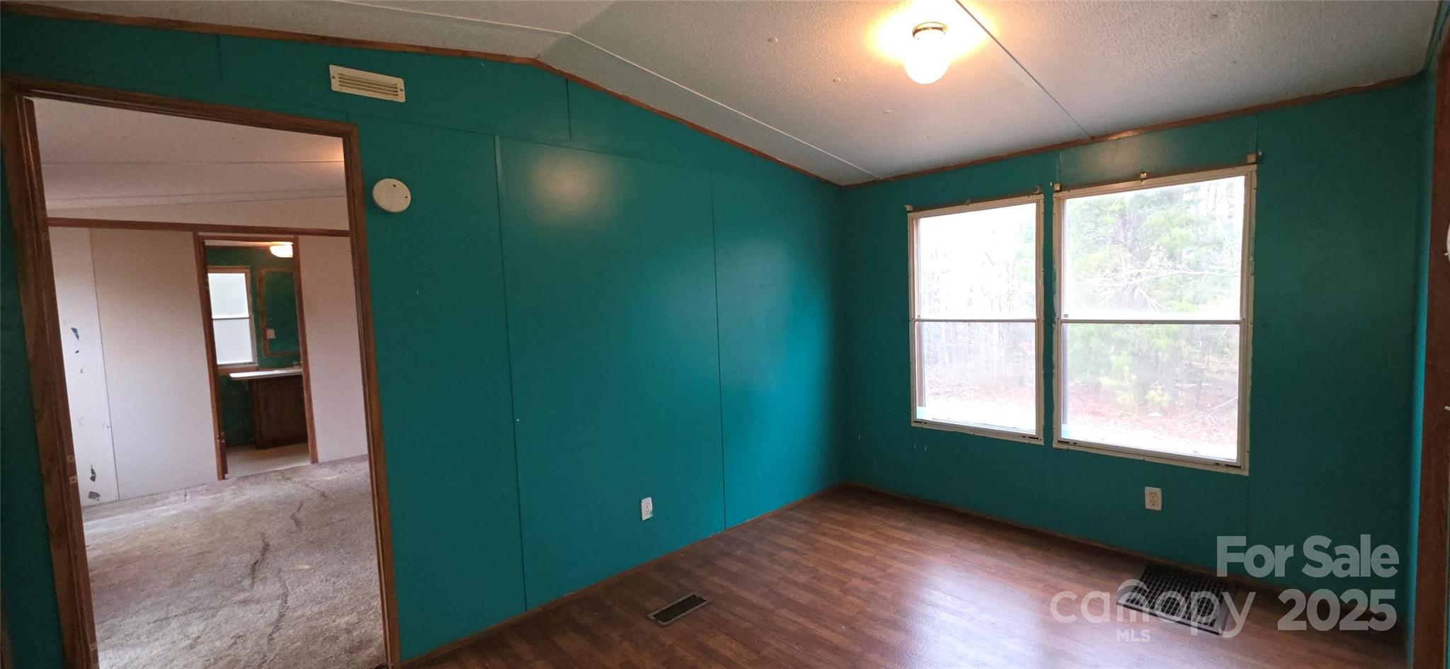 2111 Boxcar Road Lancaster, SC 29720 - Photo 3 of 21 wooden floor in an empty room with a window