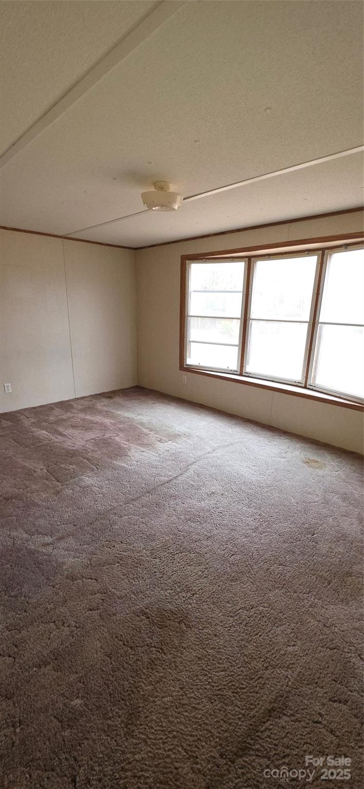2111 Boxcar Road Lancaster, SC 29720 - Photo 9 of 21 wooden floor in an empty room with a window