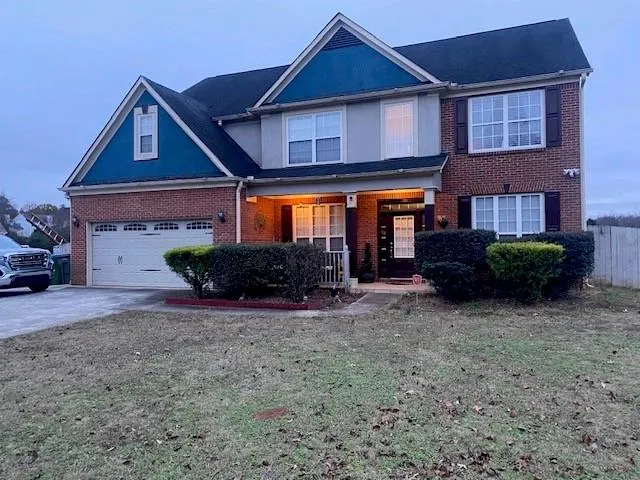 a house view with a garden space