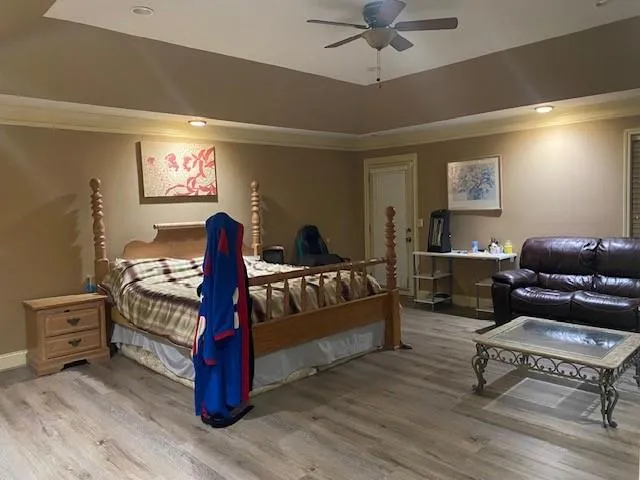a bedroom with a bed and a couch