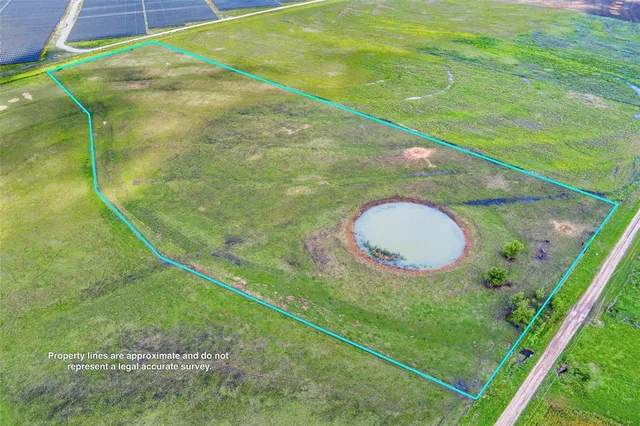 a view of a pool and a yard