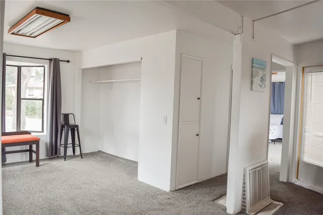 a view of room with furniture and a window