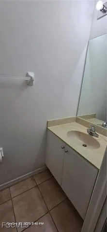 a bathroom with a sink and vanity
