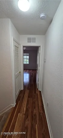 a view of entryway and wooden floor