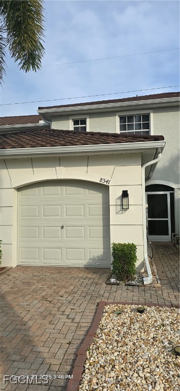 8541 Athena Court Lehigh Acres, FL 33971 - Photo 30 of 47 a front view of a house with garden