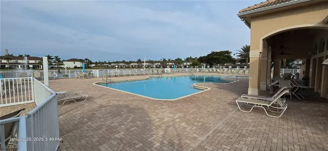a view of a swimming pool and deck