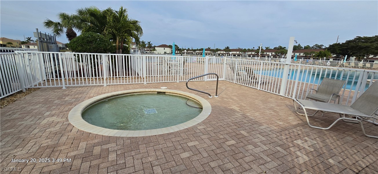 8541 Athena Court Lehigh Acres, FL 33971 - Photo 36 of 47 a view of a swimming pool and deck