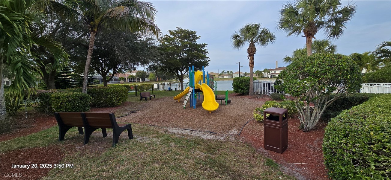 8541 Athena Court Lehigh Acres, FL 33971 - Photo 37 of 47 a view of a yard with furniture and a slide