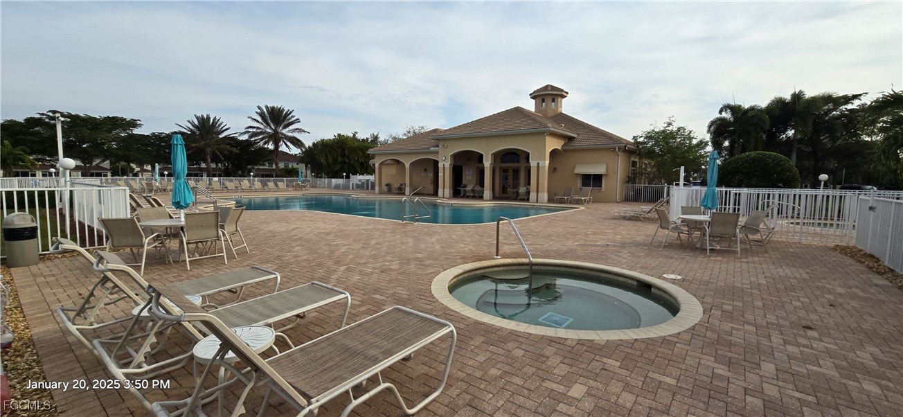 8541 Athena Court Lehigh Acres, FL 33971 - Photo 41 of 47 a front view of a house with garden