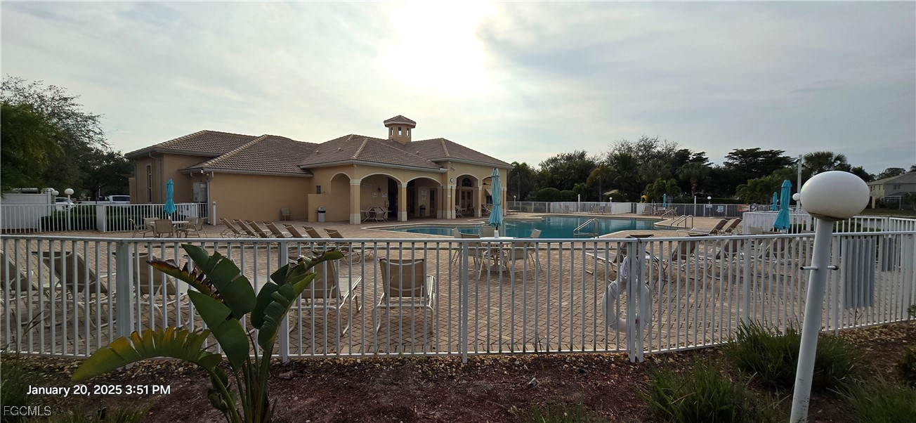 8541 Athena Court Lehigh Acres, FL 33971 - Photo 42 of 47 a view of a house with a balcony