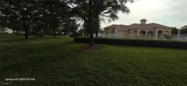 a view of a patio with a table and chairs