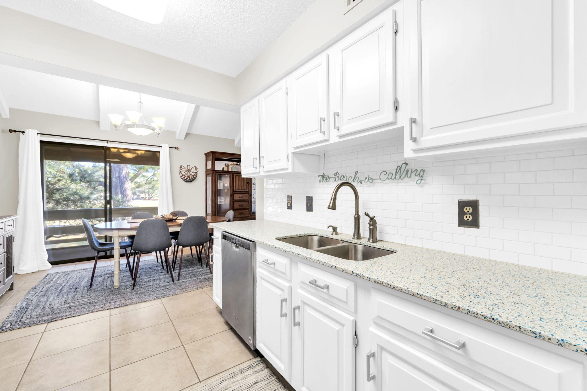 a kitchen with stainless steel appliances granite countertop a sink and cabinets