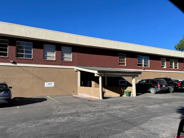a view of a building with a door and a window