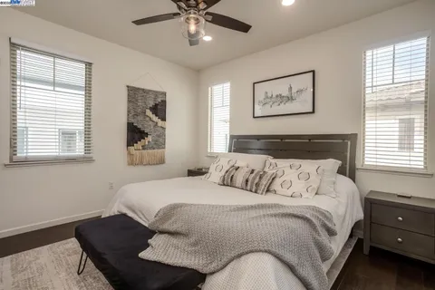 a bedroom with a bed and window