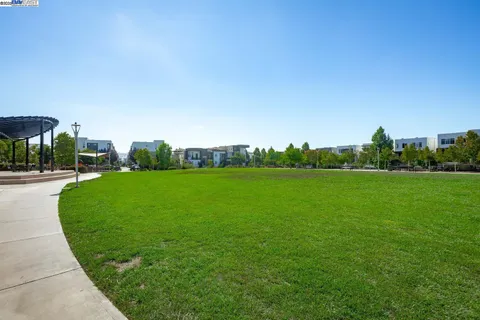 a view of a garden and basketball court