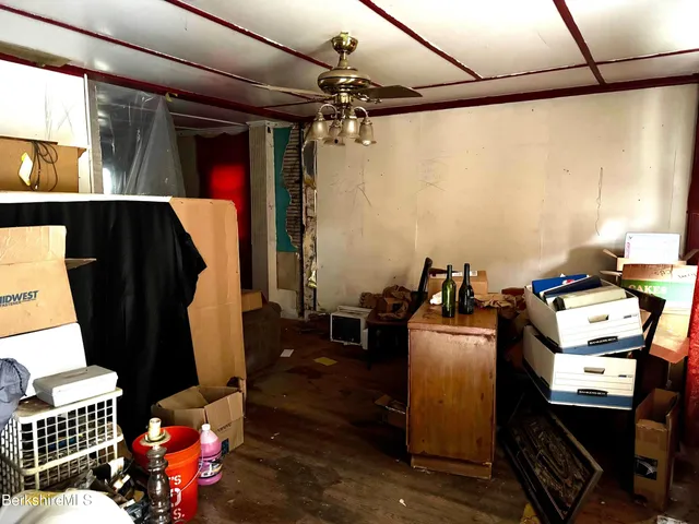 a room with furniture and musical instruments