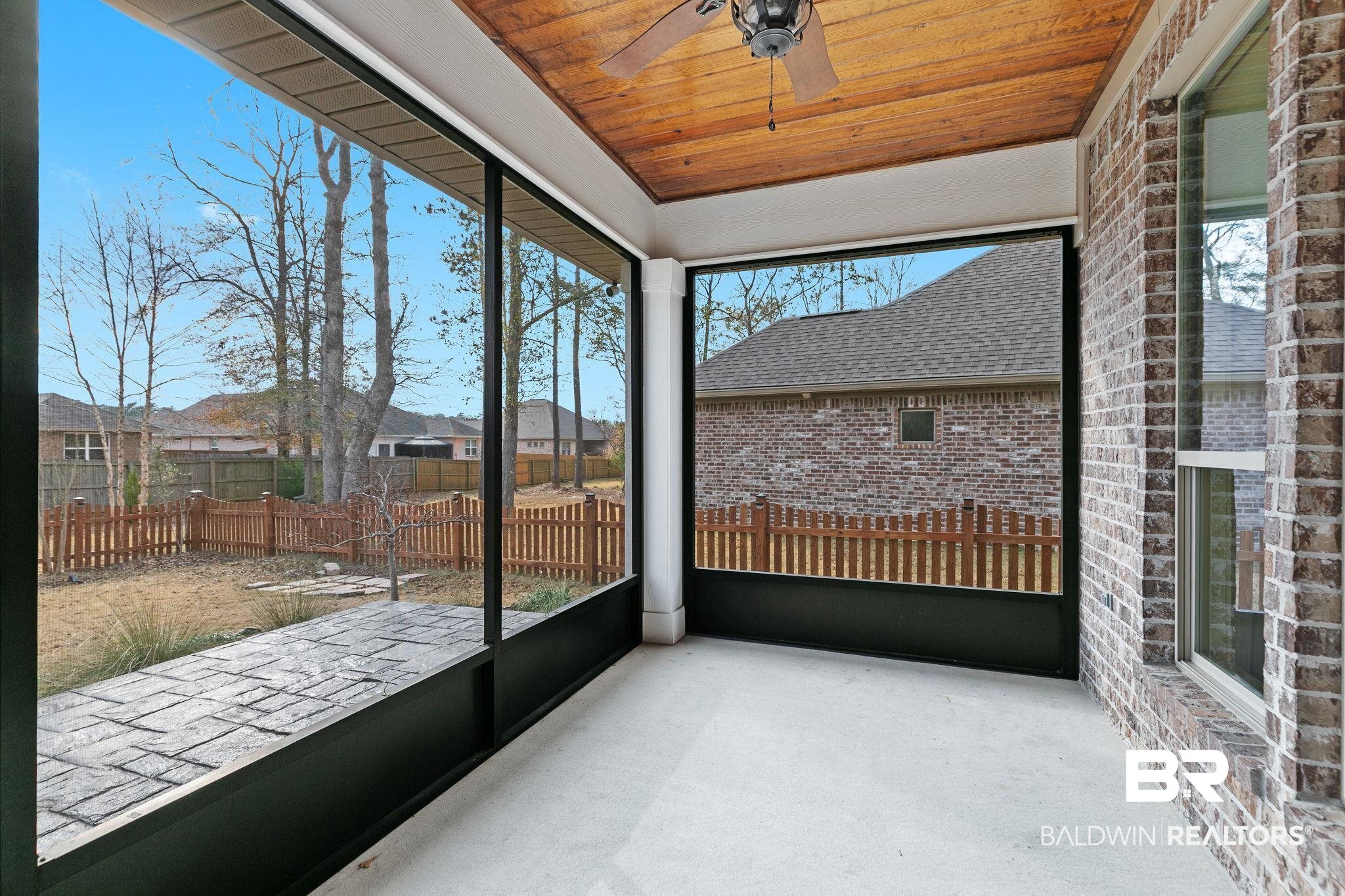 31654 Canopy Loop Daphne, AL 36527 - Photo 26 of 64 Unfurnished sunroom with a ceiling fan and a residential view