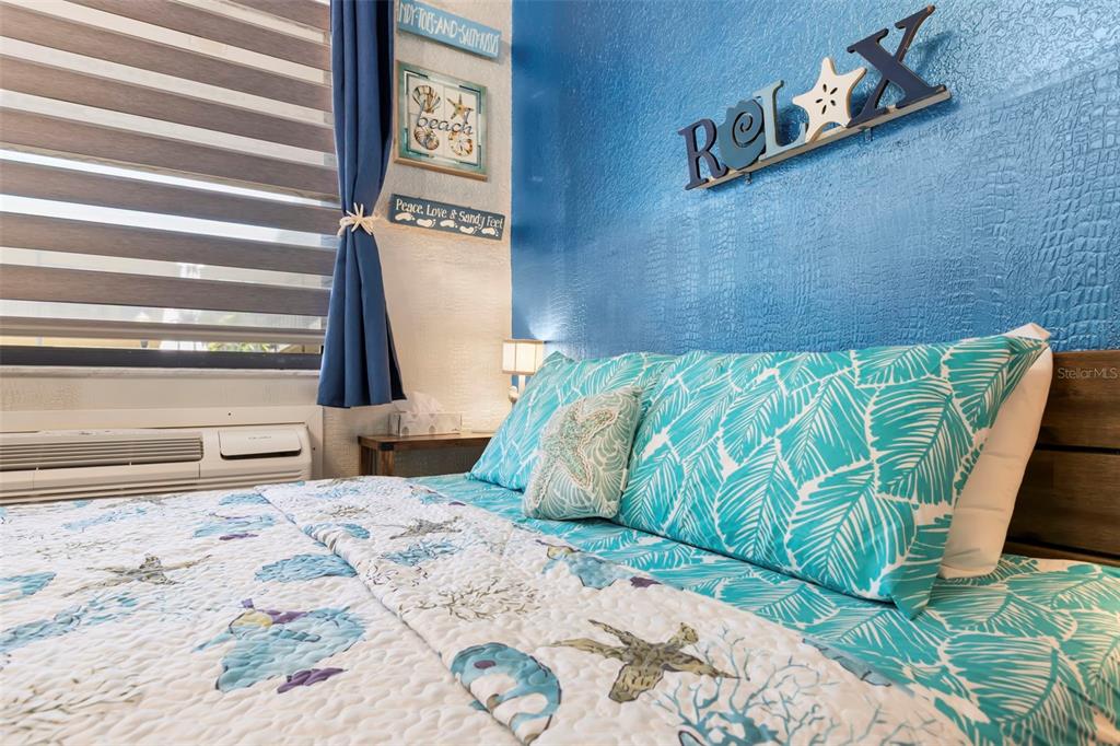 16333 Gulf Boulevard, Unit 113 Redington Beach, FL 33708 - Photo 12 of 40 a bedroom with a bed and a window