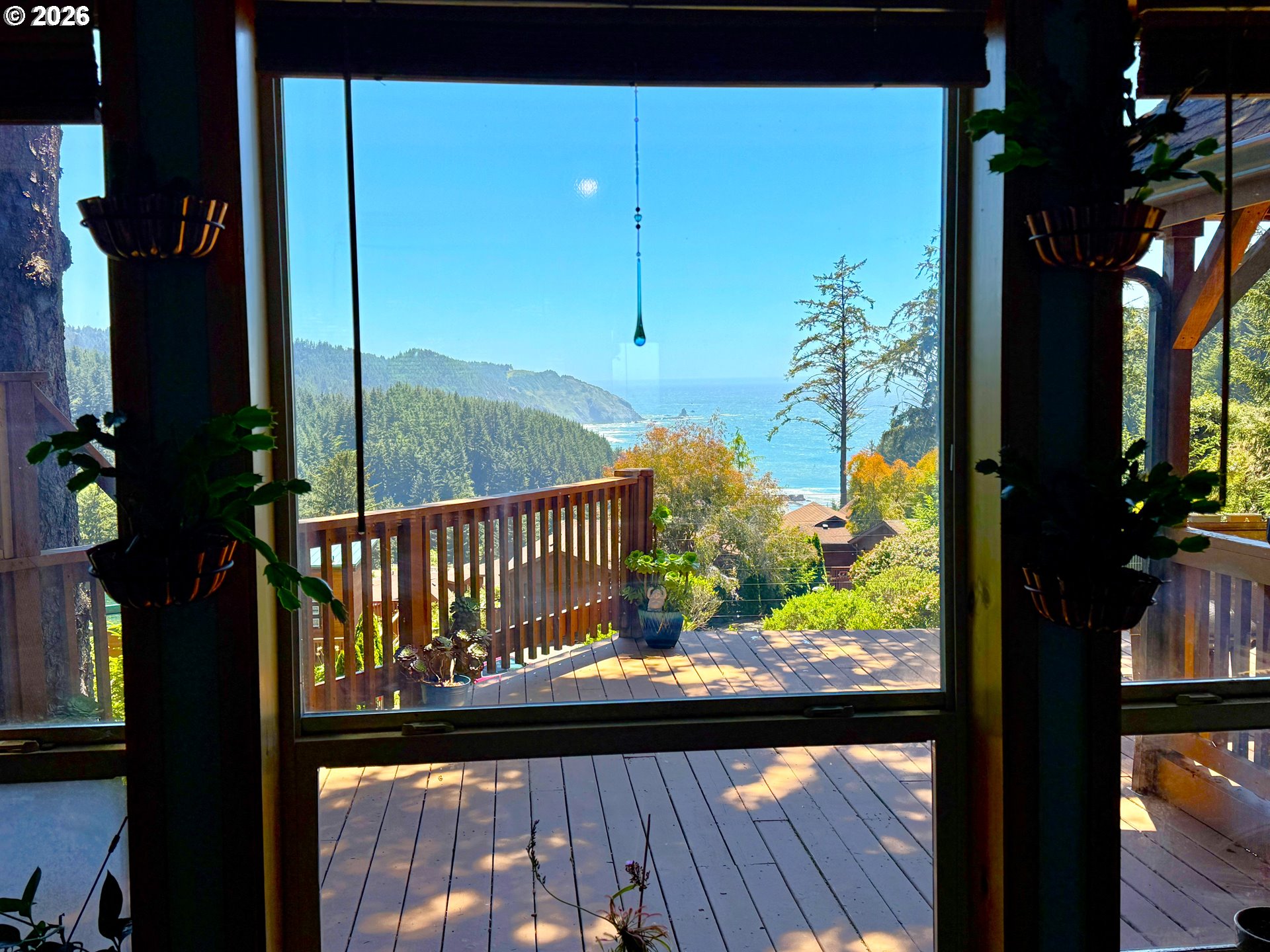 19921 Whaleshead Road, Unit U25 Brookings, OR 97415 - Photo 15 of 47 a view of a balcony with a floor to ceiling windows