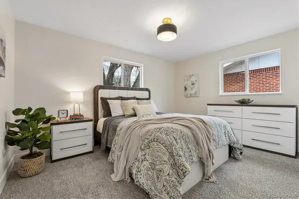 a bed room with a bed and a window