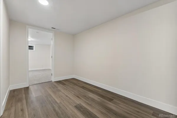 a view of room with wooden floor