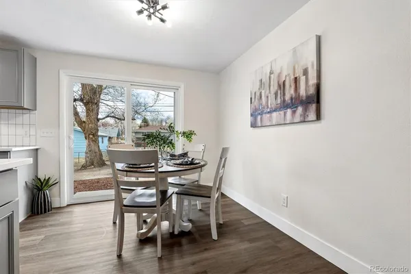 a view of a dining room with furniture window and wooden floor