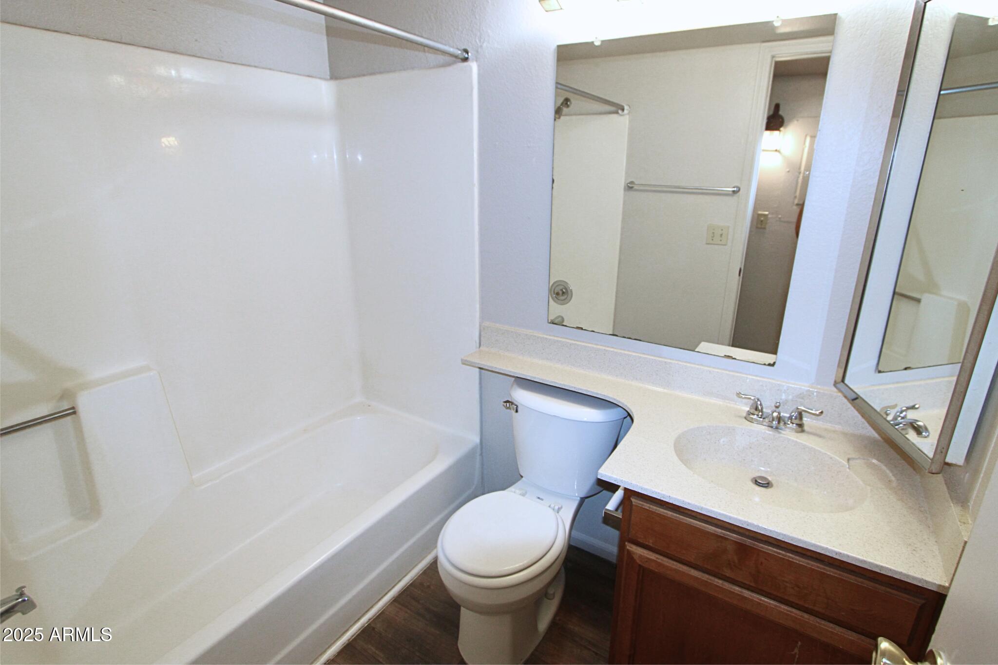 623 West Guadalupe Road, Unit 261 Mesa, AZ 85210 - Photo 11 of 24 a bathroom with a sink toilet and shower