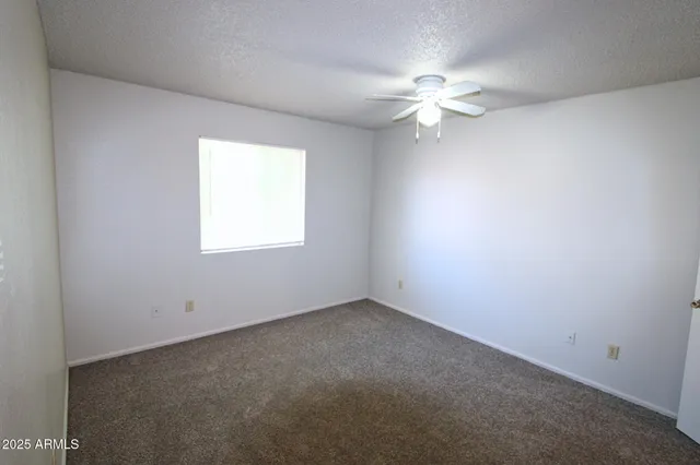 a bathroom with a sink a toilet a mirror and shower
