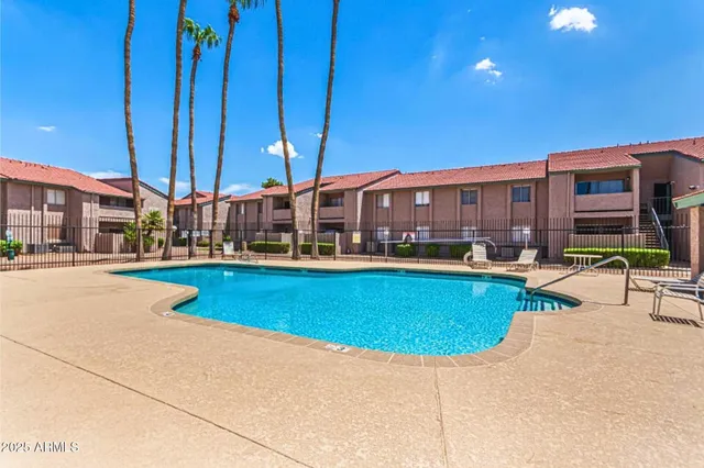 a view of a house with swimming pool