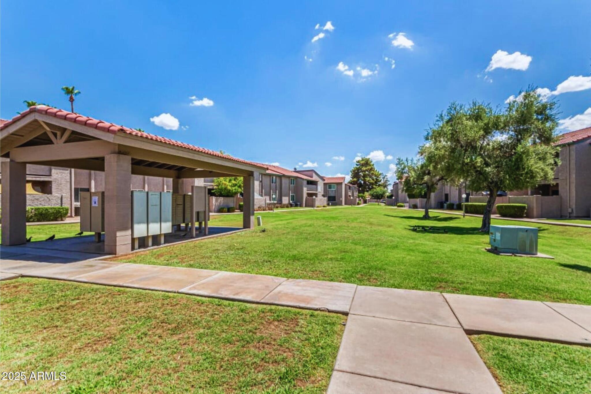 623 West Guadalupe Road, Unit 261 Mesa, AZ 85210 - Photo 21 of 24 a front view of house with yard and green space