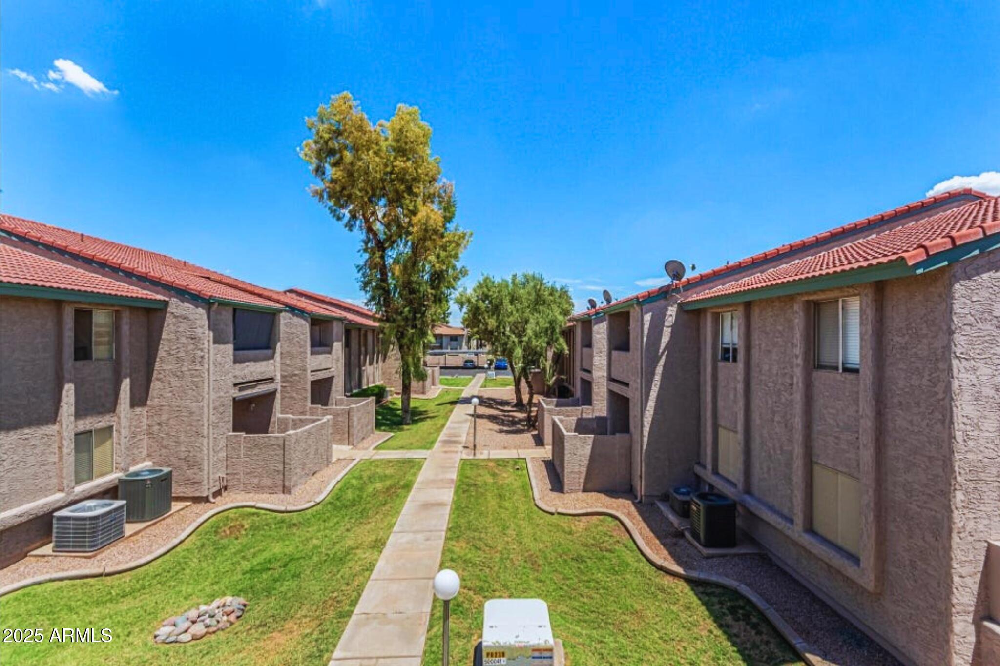 623 West Guadalupe Road, Unit 261 Mesa, AZ 85210 - Photo 23 of 24 a backyard of a house with seating space