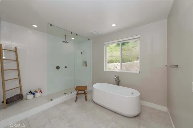 a bathroom with a toilet sink and shower