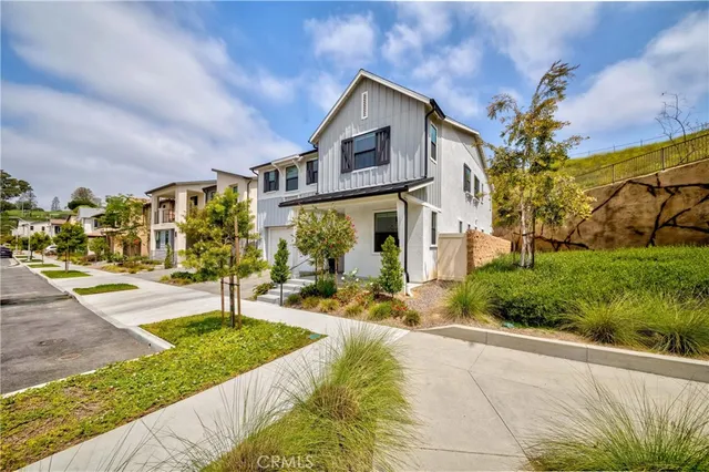 a view of a patio with couches and potted plants