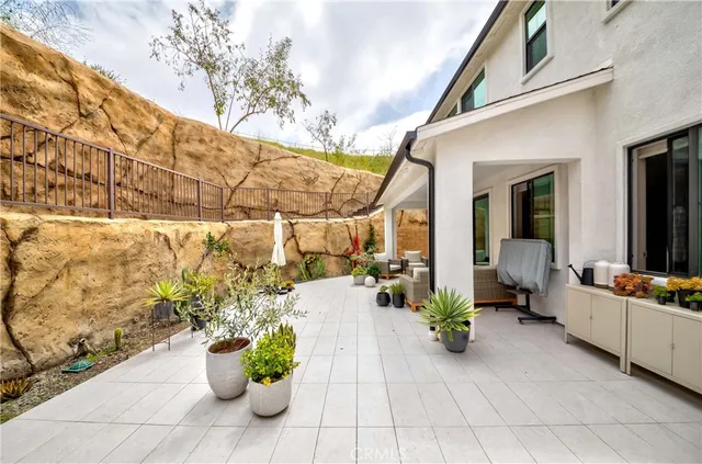 a outdoor living space with furniture and flowers