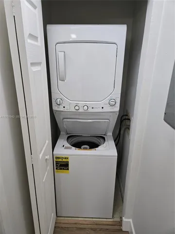 a view of hallway with wooden floor
