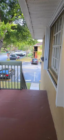 a view of an chairs and table in the balcony