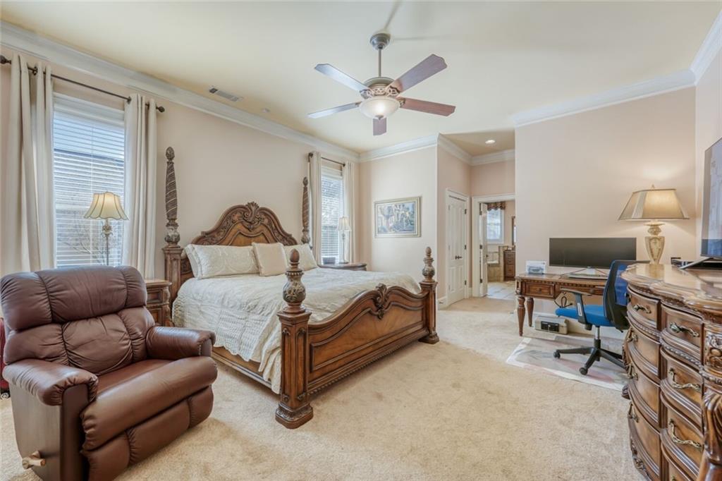 2380 Muskogee Lane Braselton, GA 30517 - Photo 21 of 30 a living room with furniture a ceiling fan and a window
