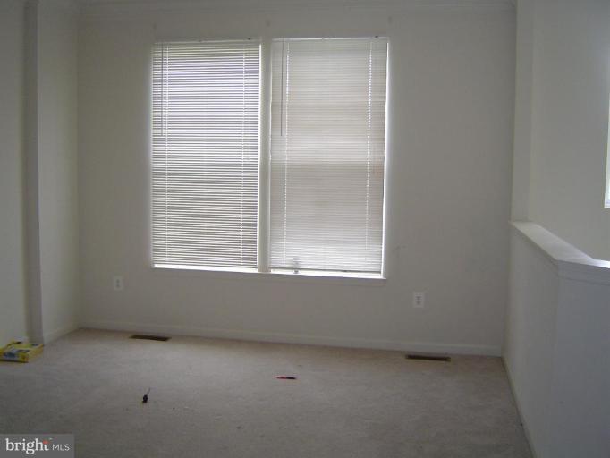 837 Middle River Road Middle River, MD 21220 - Photo 5 of 6 a view of an empty room with a window