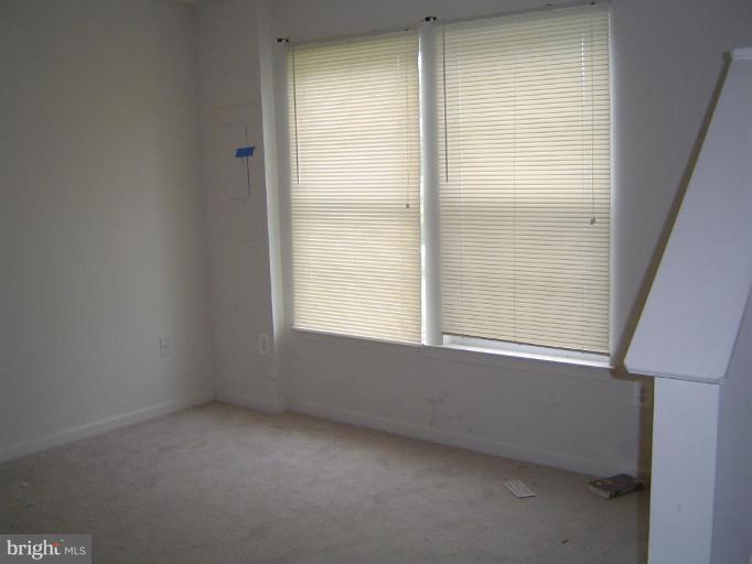837 Middle River Road Middle River, MD 21220 - Photo 6 of 6 a view of an empty room with a window
