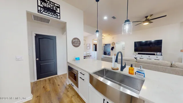 a view of a livingroom with furniture and a flat screen tv