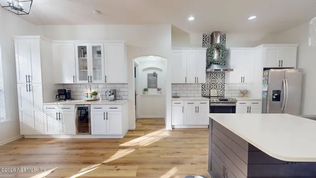 a bed room with a bed and a chandelier