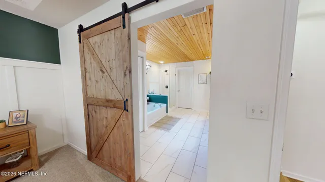 a bathroom with a tub and shower