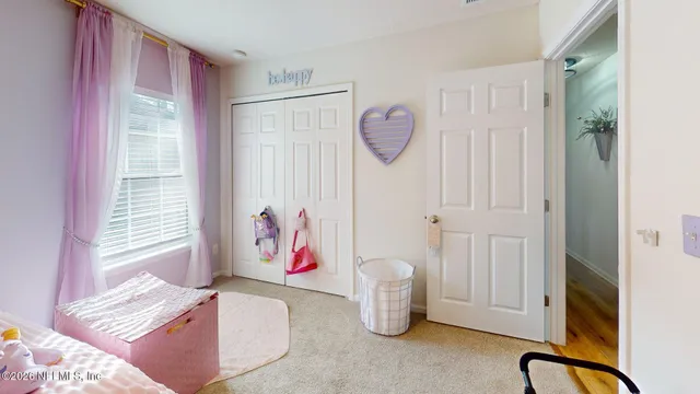 a view of a hallway to a livingroom and a hallway